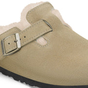 Close-up of the buckle, Taupe suede strap and shearling lining on the Birkenstock Boston Shearling clog