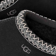 UGG Women's Tasman II Slipper in Black — close-up of the braid trim