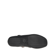 Taos Women's Banter flat in black, outsole view showing the chevron tread