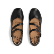 Taos Women's Banter flat in black, top-down view of the pair showing the cushioned footbed